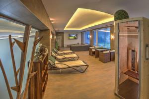 a living room with couches and a living room with at Jugendhotel Bachlehen und Johanneshof in Radstadt