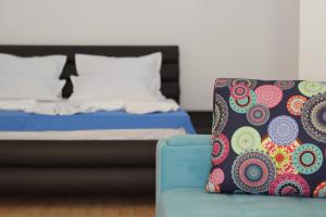 Un pat sau paturi într-o cameră la PASHA HOTEL