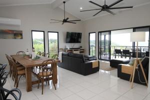 a living room with a couch and a table at Nirvana in Tangalooma