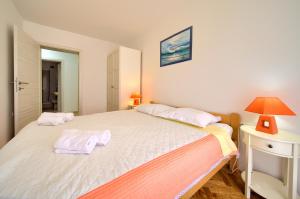 Postel nebo postele na pokoji v ubytování Apartments Rose