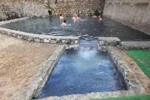 a group of people in a pool of water at Comodo appartamento in zona centrale e strategica. in Lamezia Terme