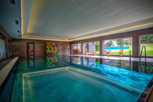 a large swimming pool in a house with a swimming pool at Jugendhotel Bachlehen und Johanneshof in Radstadt