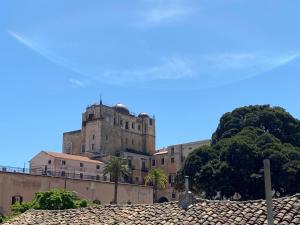 an old castle on top of a building at La Piccola Formica Charme Rooms in Palermo