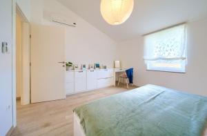 Postel nebo postele na pokoji v ubytování Apartments Aster