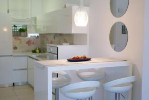 Kuchyň nebo kuchyňský kout v ubytování Apartments Aster