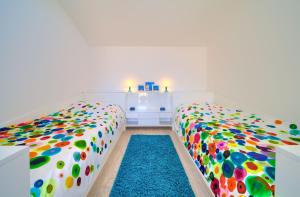 Postel nebo postele na pokoji v ubytování Apartments Aster
