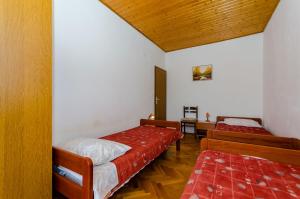 Postel nebo postele na pokoji v ubytování Apartments Kursan