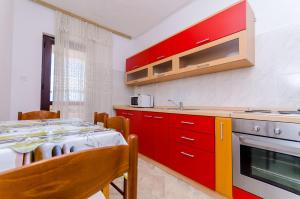 Kuchyň nebo kuchyňský kout v ubytování Apartments Kursan