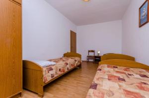 Postel nebo postele na pokoji v ubytování Apartments Kursan