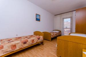 Postel nebo postele na pokoji v ubytování Apartments Kursan