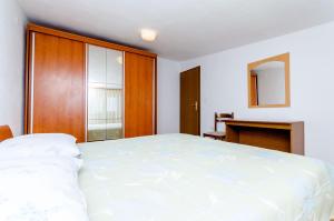 Postel nebo postele na pokoji v ubytování Apartments Kursan