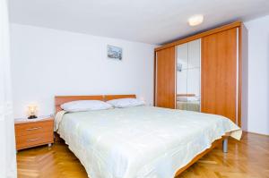 Postel nebo postele na pokoji v ubytování Apartments Kursan