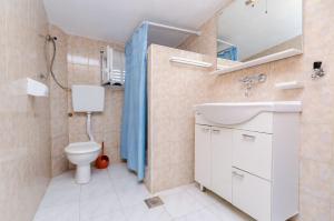 Koupelna v ubytování Apartments Kursan