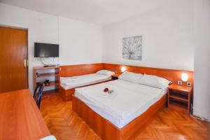 Ένα ή περισσότερα κρεβάτια σε δωμάτιο στο Apartments Jacqueline