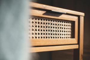 a wooden box with a metal grate on it at Cedar House in Gisborne