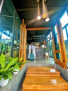 two men standing in theoyer of a building at Family House Zen Boutique Resort in Pai