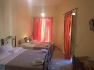 Posteľ alebo postele v izbe v ubytovaní B&B Batarà - "La Terrazza del Centro"