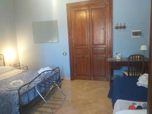 Posteľ alebo postele v izbe v ubytovaní B&B Batarà - "La Terrazza del Centro"