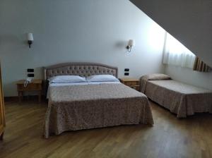 Postel nebo postele na pokoji v ubytování Uliveto Principessa Resort