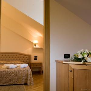Postel nebo postele na pokoji v ubytování Uliveto Principessa Resort