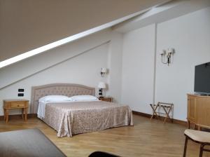 Postel nebo postele na pokoji v ubytování Uliveto Principessa Resort