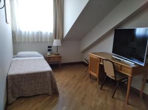 TV a/nebo společenská místnost v ubytování Uliveto Principessa Resort