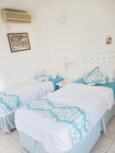 Postel nebo postele na pokoji v ubytování Blue Topaz