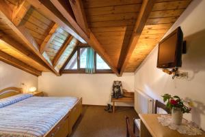 Ένα ή περισσότερα κρεβάτια σε δωμάτιο στο Albergo Moleta