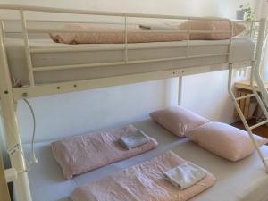 a bedroom with a bunk bed with two towels at Sishaus - View at Mozarts in Salzburg