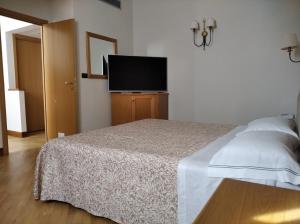 Postel nebo postele na pokoji v ubytování Uliveto Principessa Resort