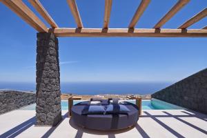 a villa with a view of the ocean at Brilliance Suites in Imerovigli