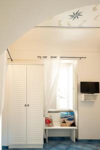 A television and/or entertainment centre at Scirocco - amazing flat with terrace in the Center