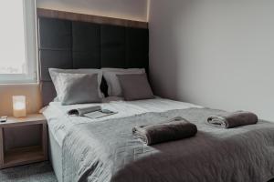 Postel nebo postele na pokoji v ubytování NOVA Apartamenty&Pokoje