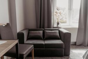 Posezení v ubytování NOVA Apartamenty&Pokoje