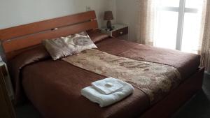 En eller flere senge i et værelse på LOCANDA MIRABEAU