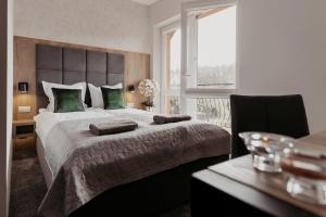 Postel nebo postele na pokoji v ubytování NOVA Apartamenty&Pokoje