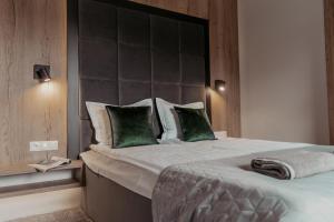 Postel nebo postele na pokoji v ubytování NOVA Apartamenty&Pokoje