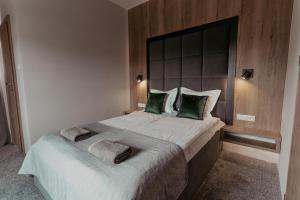 Postel nebo postele na pokoji v ubytování NOVA Apartamenty&Pokoje