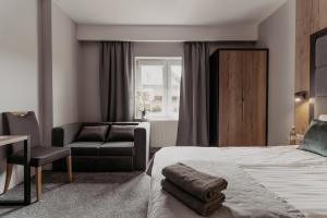 Postel nebo postele na pokoji v ubytování NOVA Apartamenty&Pokoje