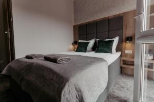 Postel nebo postele na pokoji v ubytování NOVA Apartamenty&Pokoje
