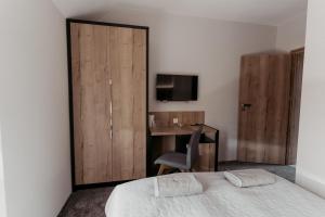 Postel nebo postele na pokoji v ubytování NOVA Apartamenty&Pokoje