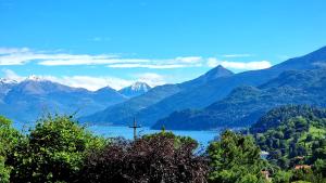 a cross on a lake with mountains in the background at B&B I LAKE IT BELLAGIO in Bellagio