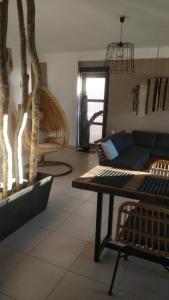 a living room with a couch and a table at Chrisambelos Apartments in Istro