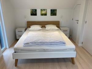 Postel nebo postele na pokoji v ubytování TERRASSES DE MALMEDY Triplex 242 " PLACE DES REVES "