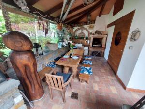a room with a table and chairs and a kitchen at Apartma Marina in Piran