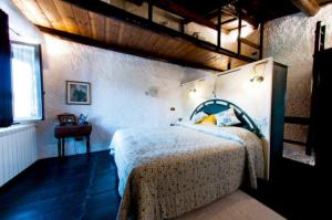 Un ou plusieurs lits dans un hébergement de l'établissement Casa Graziella al Borgo