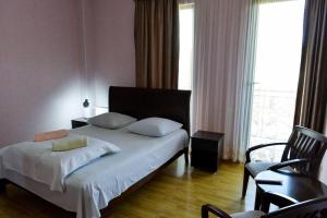 Postel nebo postele na pokoji v ubytování Argopalace