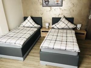 A bed or beds in a room at City Pension