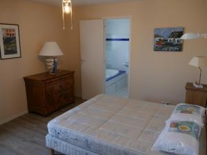 Een bed of bedden in een kamer bij Une Vue Exceptionnelle