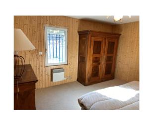 Een bed of bedden in een kamer bij Une Vue Exceptionnelle